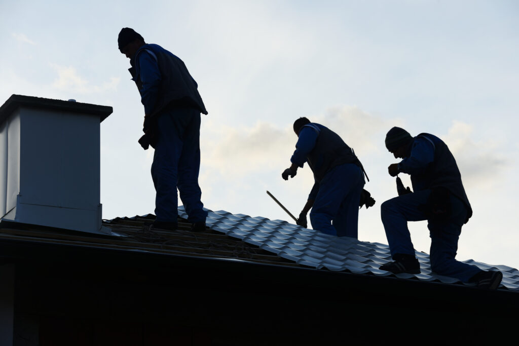 building roof construction site teamwork SBI 300934452 1